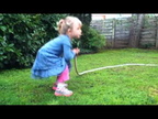 Ada waters the yard