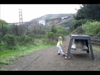Ada ringing the bell at Bay Area Discovery Museum